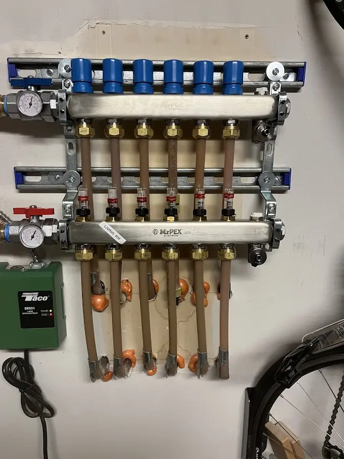 Plumber performing Water Heater Repair at a residential property in Sheridan